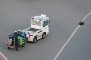 Airport baggage vehicle returns to its lost luggage